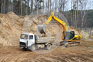 Backhoe loader loading dumper