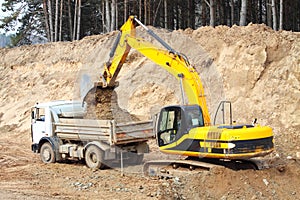 Backhoe loader loading dumper