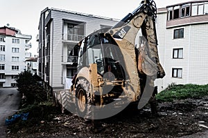 Backhoe Loader In Side Street