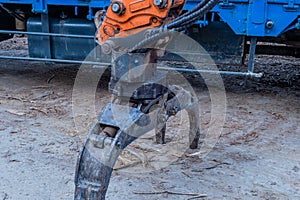 Backhoe log grapple attachment