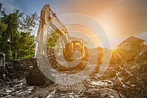 Backhoe to excavate the soil on the ground construction site