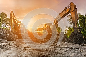 Backhoe to excavate the soil on the ground construction site