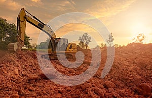 Backhoe working by digging soil at construction site. Bucket teeth of backhoe digging soil. Excavator digging on earth. Excavating