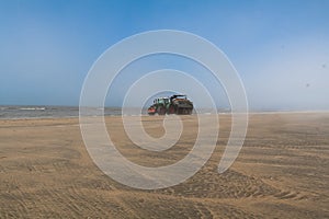 BAckhoes on the beach