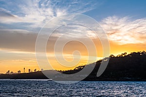 Backlight skyline of Sydney CBD from the bay at sunset