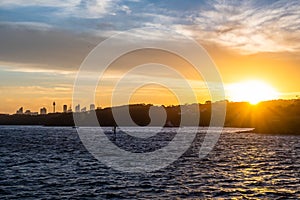 Backlight skyline of Sydney CBD from the bay at sunset