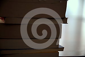 A backlighted stack of books