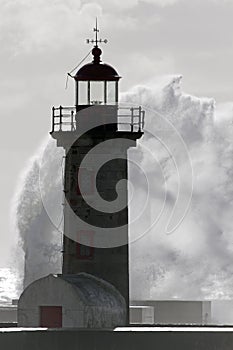 Backlit lighthouse during storm