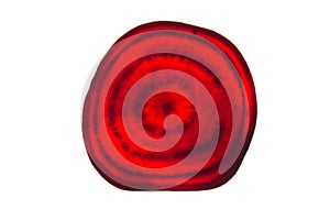 Backlit of red beetroot round slices on white, pattern for textured background. Abstract art composition of fresh organic