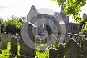 A backlit view of the ruins of the historic Greyabbey Monastery