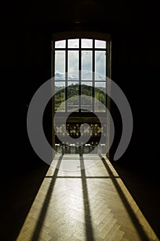 Backlit window with landscape back photo