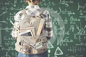 Backpack female student chalkboard background