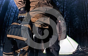 Backpack and gear woods composition.