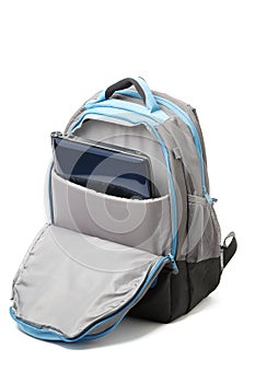 Backpack with a laptop inside isolated photo