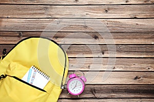 Backpack with notebook and clock