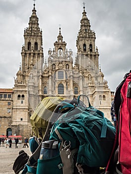 Backpack of pilgrim with the Santiago de Compostela Cathedral in the Obradoiro square in Santiago de Compostela