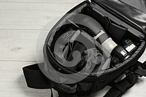 Backpack with professional photographer`s equipment