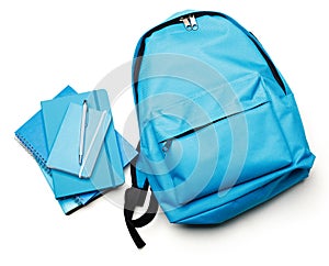 Backpack with school supplies, backpack and blue ring binder book, notebook isolated on white