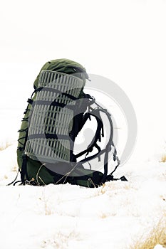 Backpack on a snow-covered field