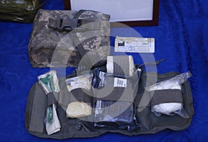 Backpack with soldier s first aid kit: bandages, wound-healing drugs, balloon with burn-treating gel, painkillers