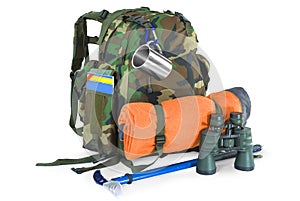 Backpack with tourist equipment on white