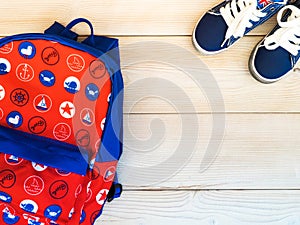 Backpack on the wooden background