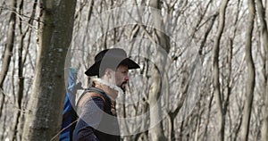 Backpacked Male Tourist in Forest