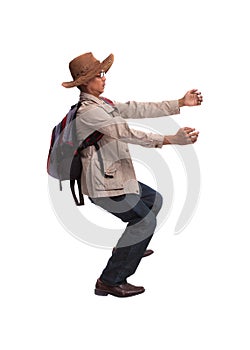 Backpacker in acting on white background