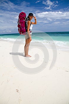 Backpacker on beach photo