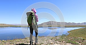 Backpacker enjoy the view on lakeside