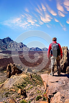 Man at the top of the Mirador de la Ruleta in Teide park on the island of Tenerife photo