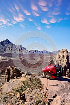 Man at the top of the Mirador de la Ruleta in Teide park on the island of Tenerife photo