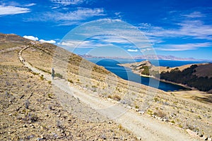 Backpacker exploring the majestic Inca Trails on Island of the Sun, Titicaca Lake, among the most scenic travel destination in Bol