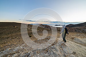 Backpacker exploring the majestic Inca Trails on Island of the Sun, Titicaca Lake, among the most scenic travel destination in Bol