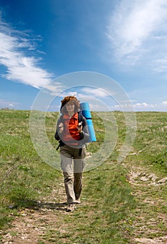 Backpacker girl hiking in crimea mountains