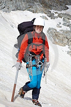 Backpacker girl with ice-axe