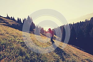 backpacker hiking on beautiful mountain peak