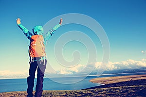 backpacker hiking on mountain peak