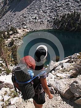 Backpacker looks at lake