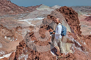 Backpacker makes hiking in the salty mountains, Hormuz Island, I