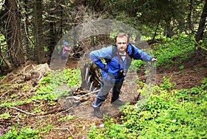 Backpacker man in mountain forest