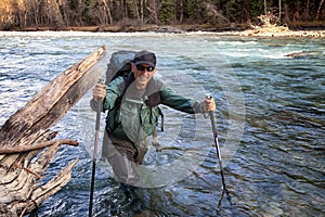 Backpacker and mountain river