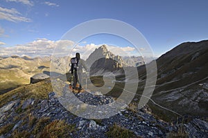 Backpacker observes the Alps