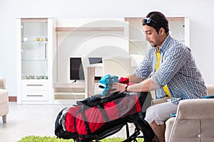 The backpacker packing for his trip