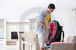 The backpacker packing for his trip