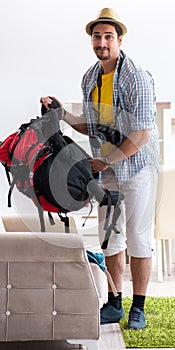Backpacker packing for his trip