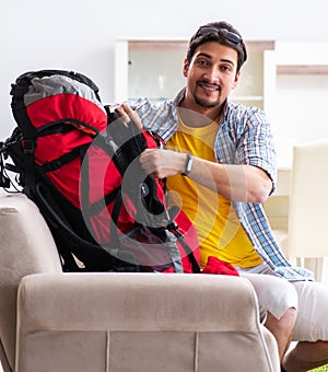 Backpacker packing for his trip