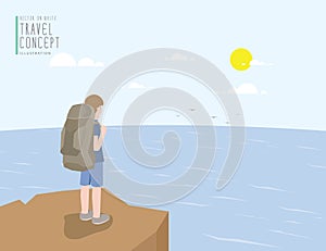Backpacker standing on a cliff looking out to the sea view. On a
