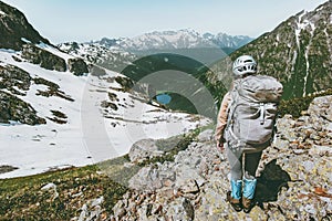 Backpacker tourist climbing mountain summit adventure