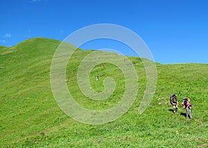 Backpacker tourist in mountain green hill
